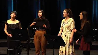 Embedded video: from left to right: Amélie, Niki, Tabea and Marie stand singing on stage in a half circle